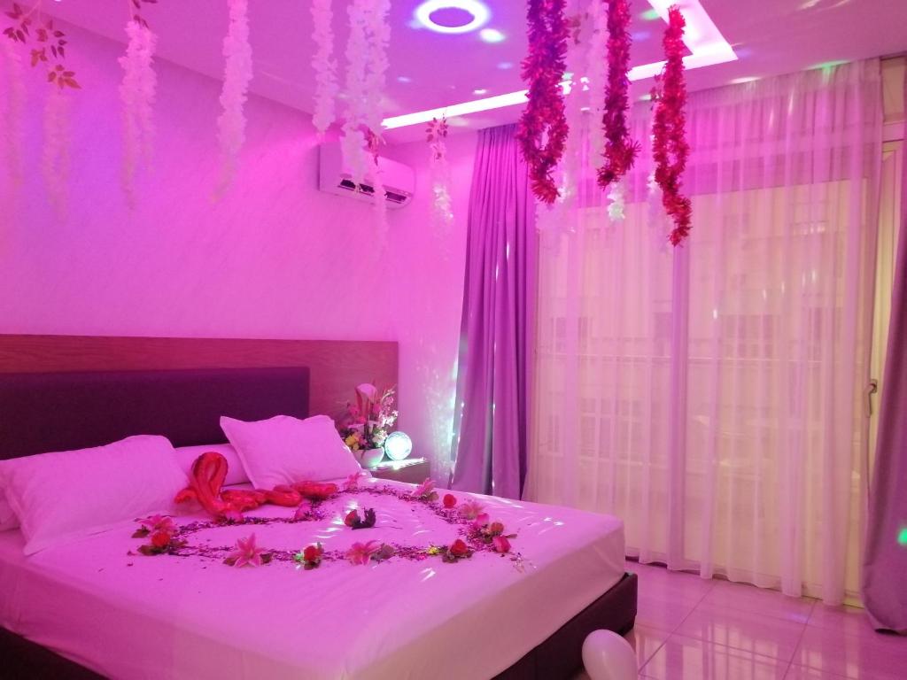 Postel nebo postele na pokoji v ubytování Hôtel laluna bay