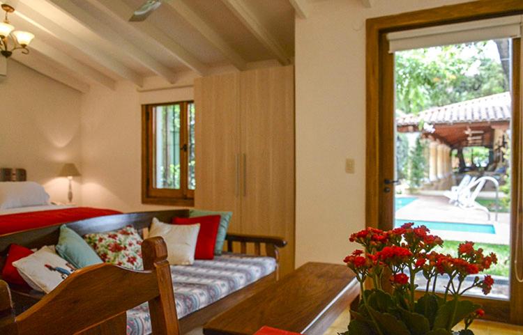 Postel nebo postele na pokoji v ubytování La Casona Hotel Boutique
