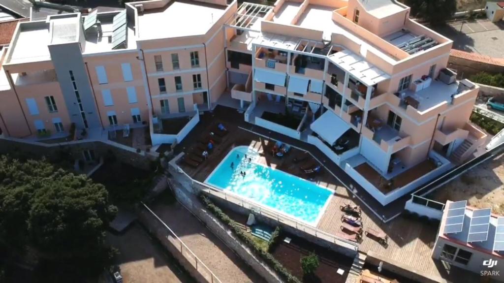an aerial view of a building and a swimming pool at Residence Le Terrazze in La Maddalena