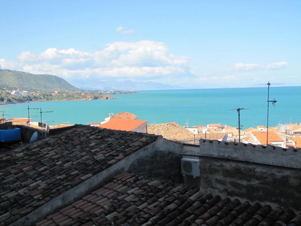 a view of the ocean from the roofs of buildings at Casa Velainvento in Cefalù
