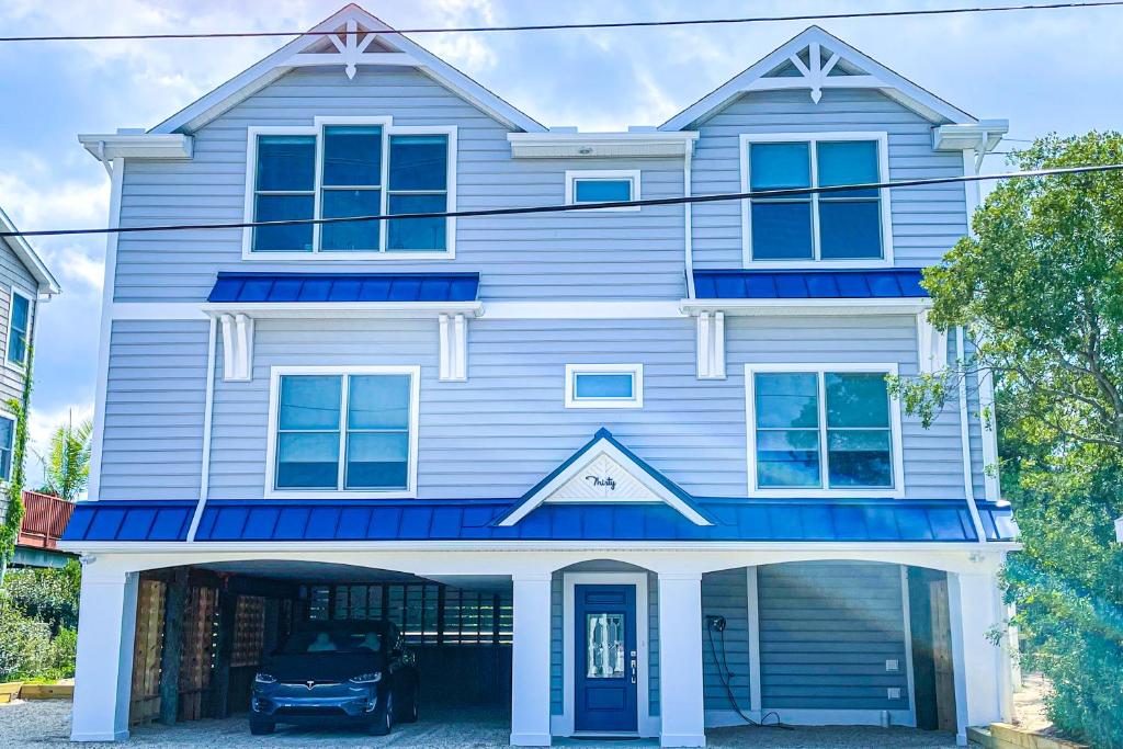 a house with a car parked in front of it at Middlesex Beach -- 30 Dune in South Bethany