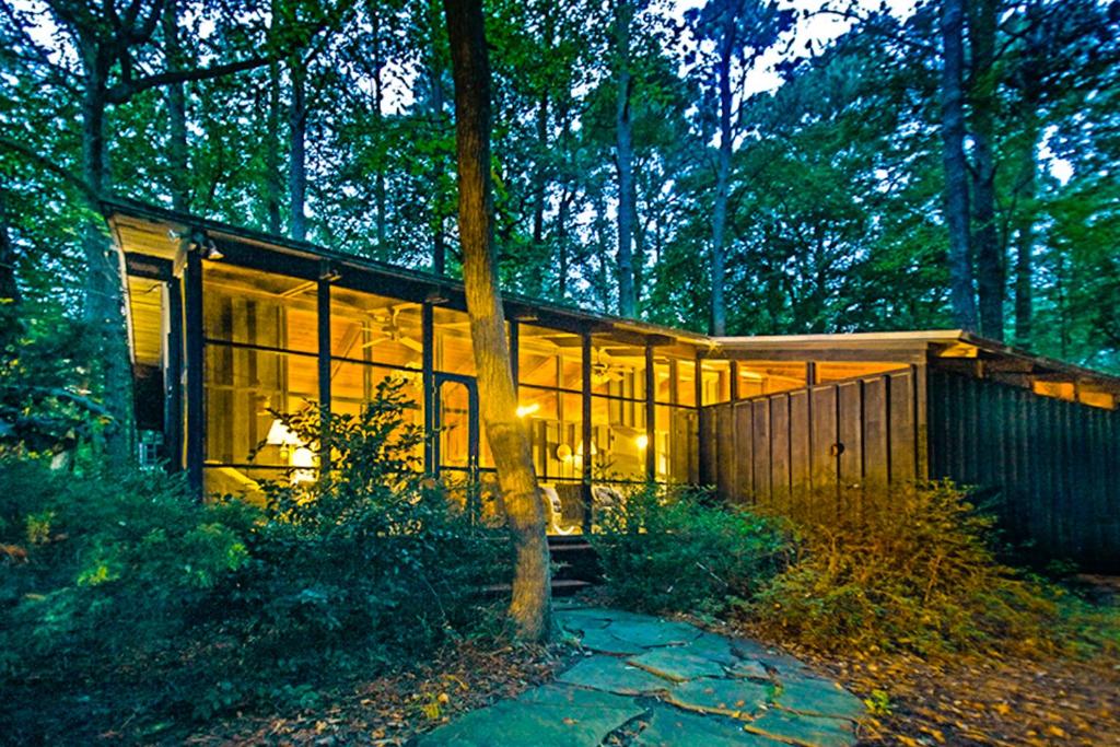 a house in the woods with lights on at Middlesex Beach -- 9 Errett in South Bethany