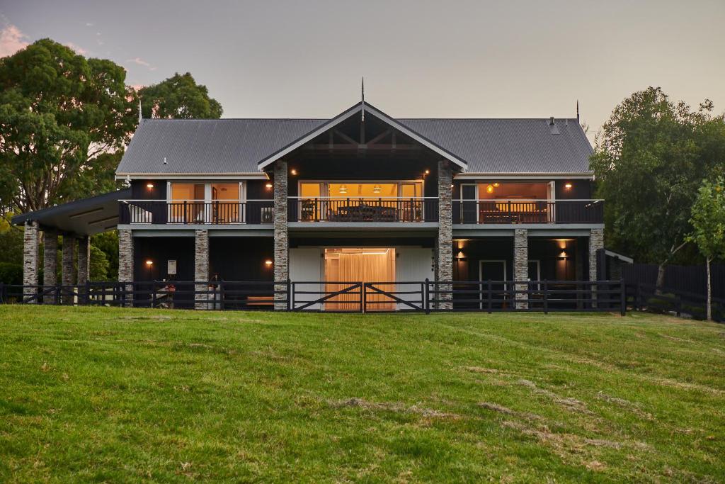 a large house with a gambrel roof at HUs - Boutique Venue & Accommodation in Riverhead