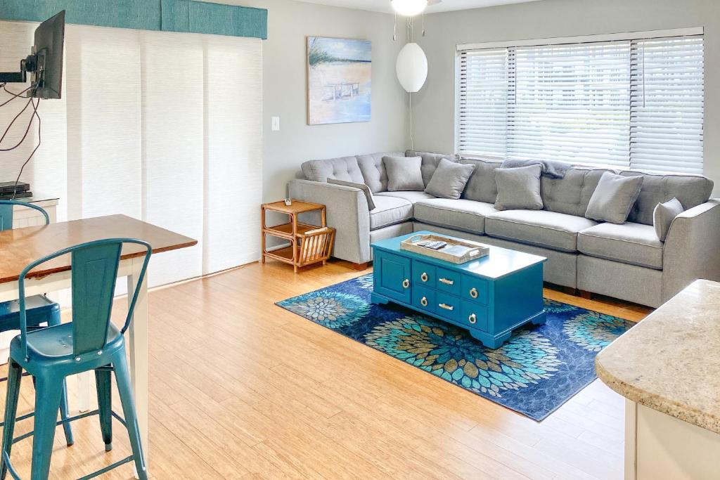 a living room with a couch and a table at Outrigger 114 in Ocean City