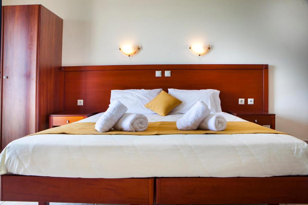Postel nebo postele na pokoji v ubytování Olive Bay Hotel