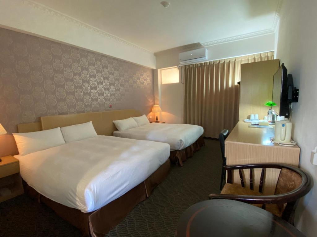 Postel nebo postele na pokoji v ubytování Dreamer Hotel