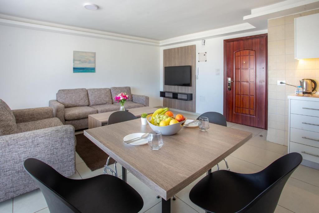 Posezení v ubytování Triple A Hotel Suites