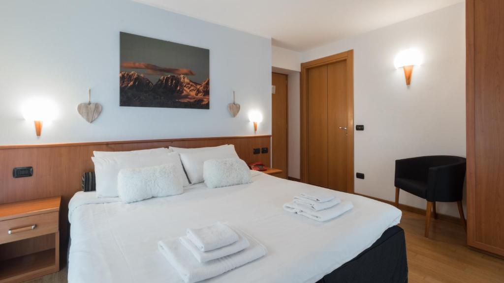 Postel nebo postele na pokoji v ubytování Residence Pizzo Scalino