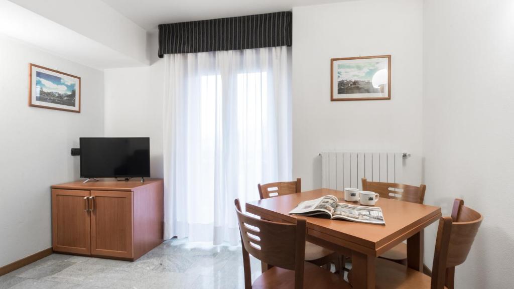 TV a/nebo společenská místnost v ubytování Residence Pizzo Scalino