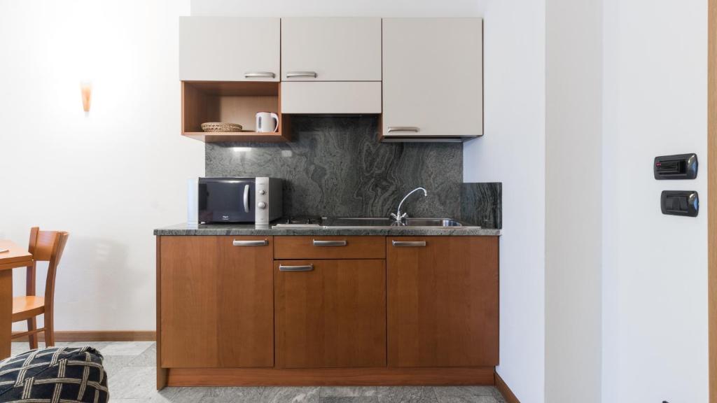 Kuchyň nebo kuchyňský kout v ubytování Residence Pizzo Scalino