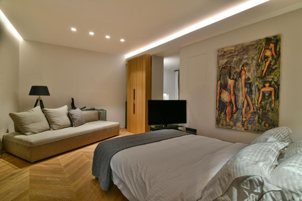 Posteľ alebo postele v izbe v ubytovaní Athens Dom Hotel