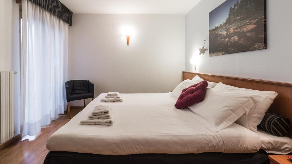 Postel nebo postele na pokoji v ubytování Residence Pizzo Scalino