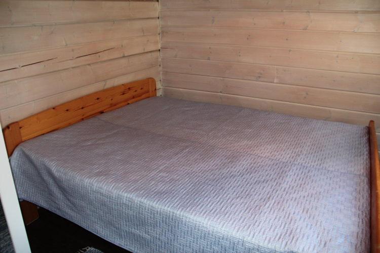 Postel nebo postele na pokoji v ubytování Villa-Anneli