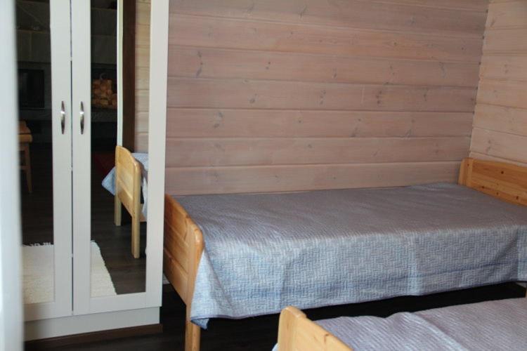 Postel nebo postele na pokoji v ubytování Villa-Anneli