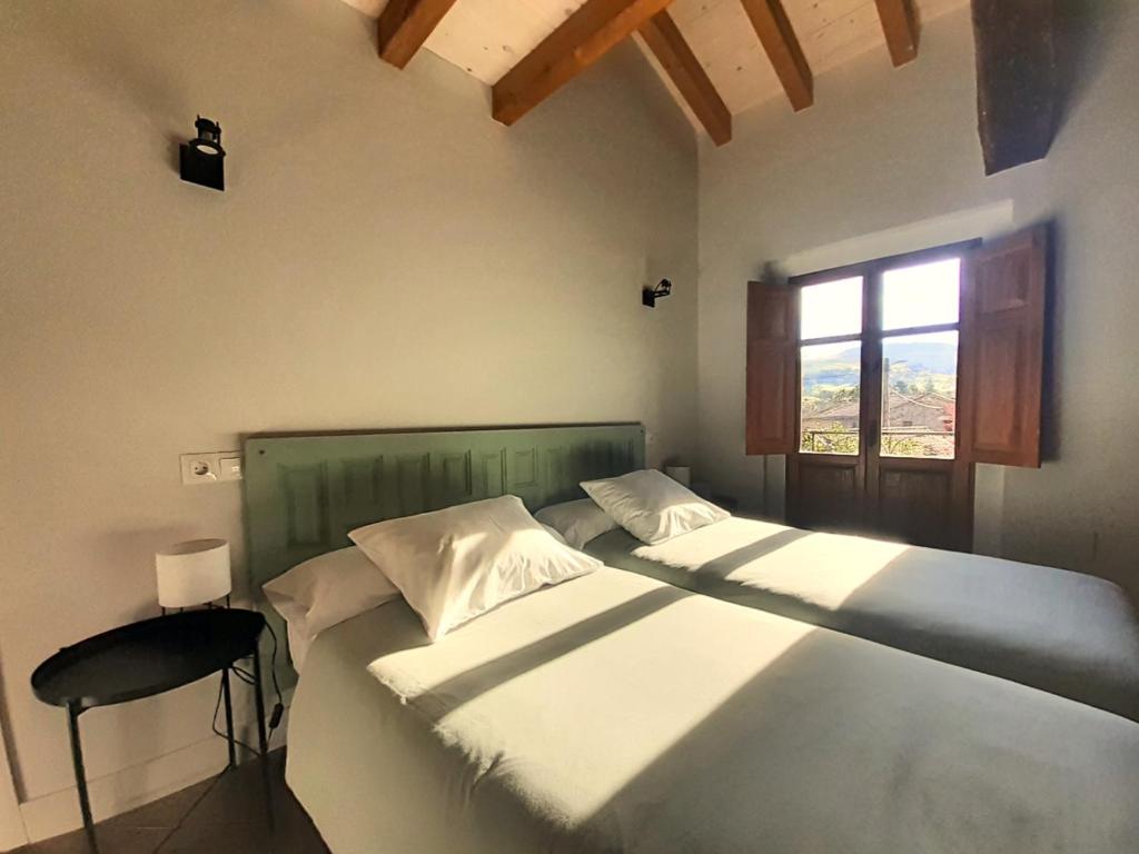 Postel nebo postele na pokoji v ubytování LA POSADA DEL TENOR