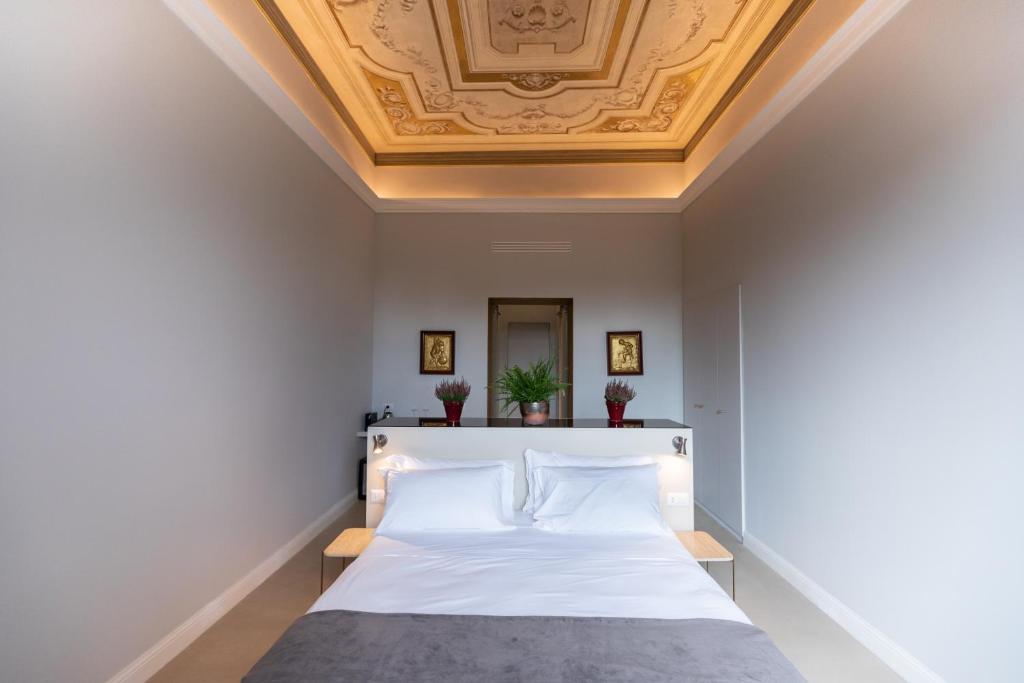 Posteľ alebo postele v izbe v ubytovaní Domus 21 Luxury Suites