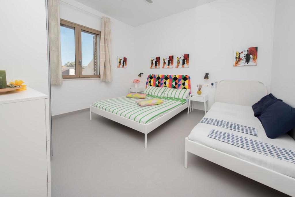 Postel nebo postele na pokoji v ubytování Arabel Villas