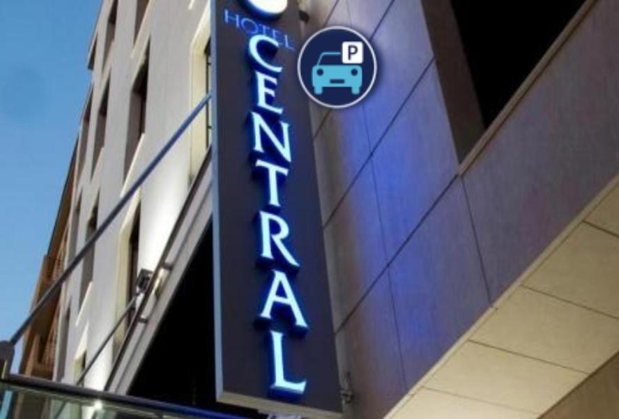 a blue sign on the side of a building at Central Hotel Sofia in Sofia