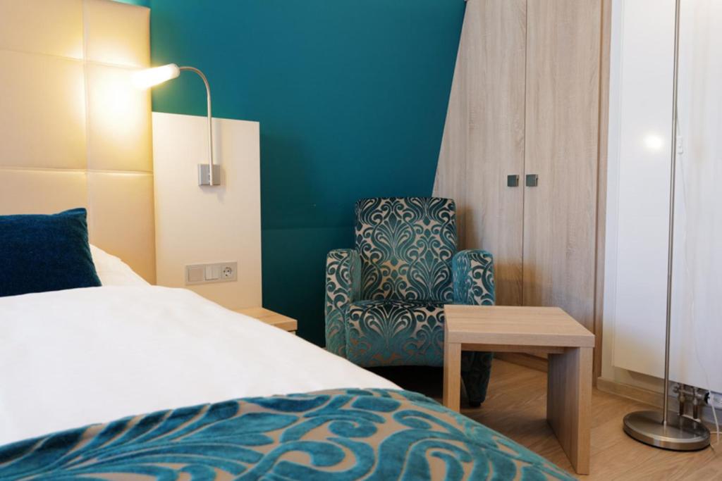 Postel nebo postele na pokoji v ubytování Hotel Trapp