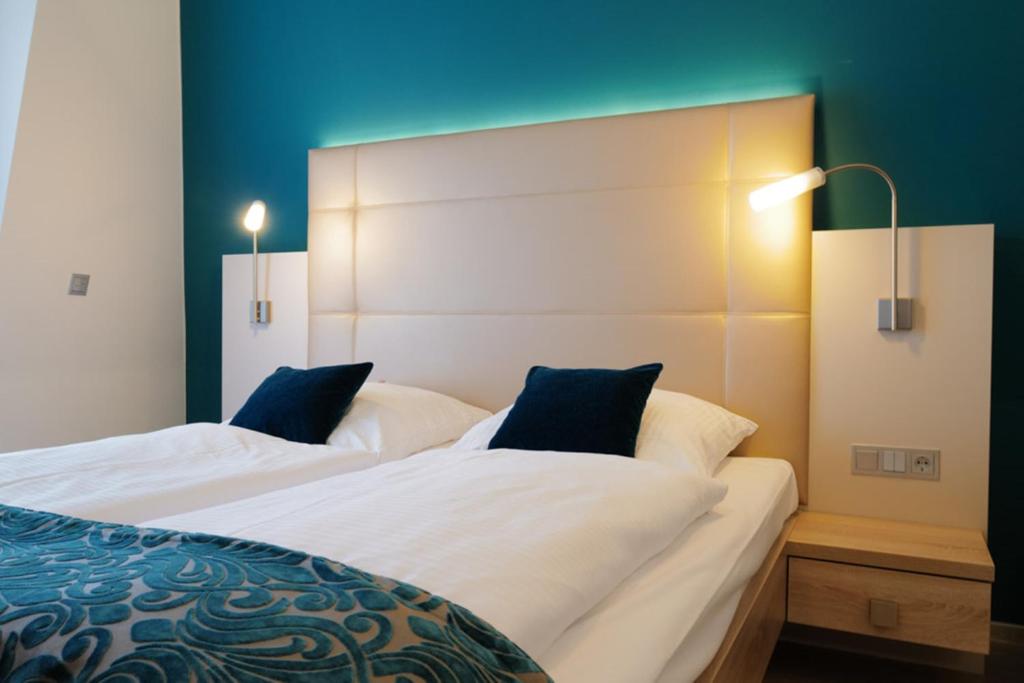 Postel nebo postele na pokoji v ubytování Hotel Trapp