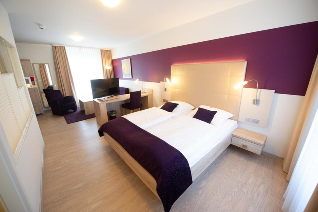 Postel nebo postele na pokoji v ubytování Hotel Trapp