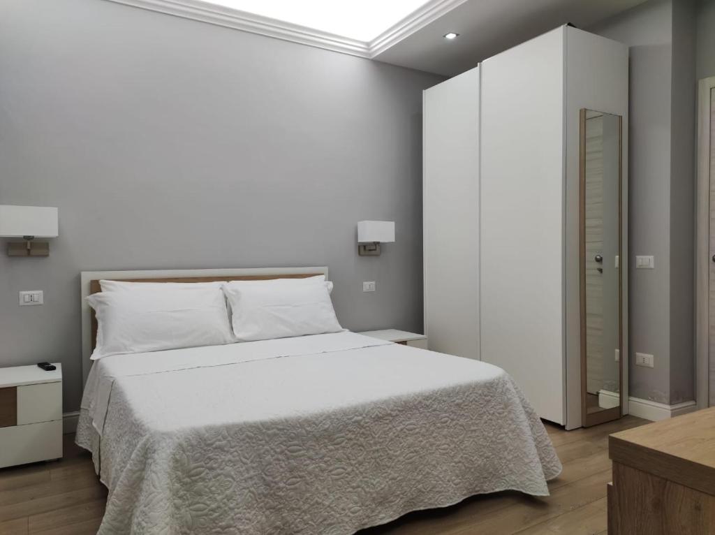 Postel nebo postele na pokoji v ubytování Porta d'Alpi