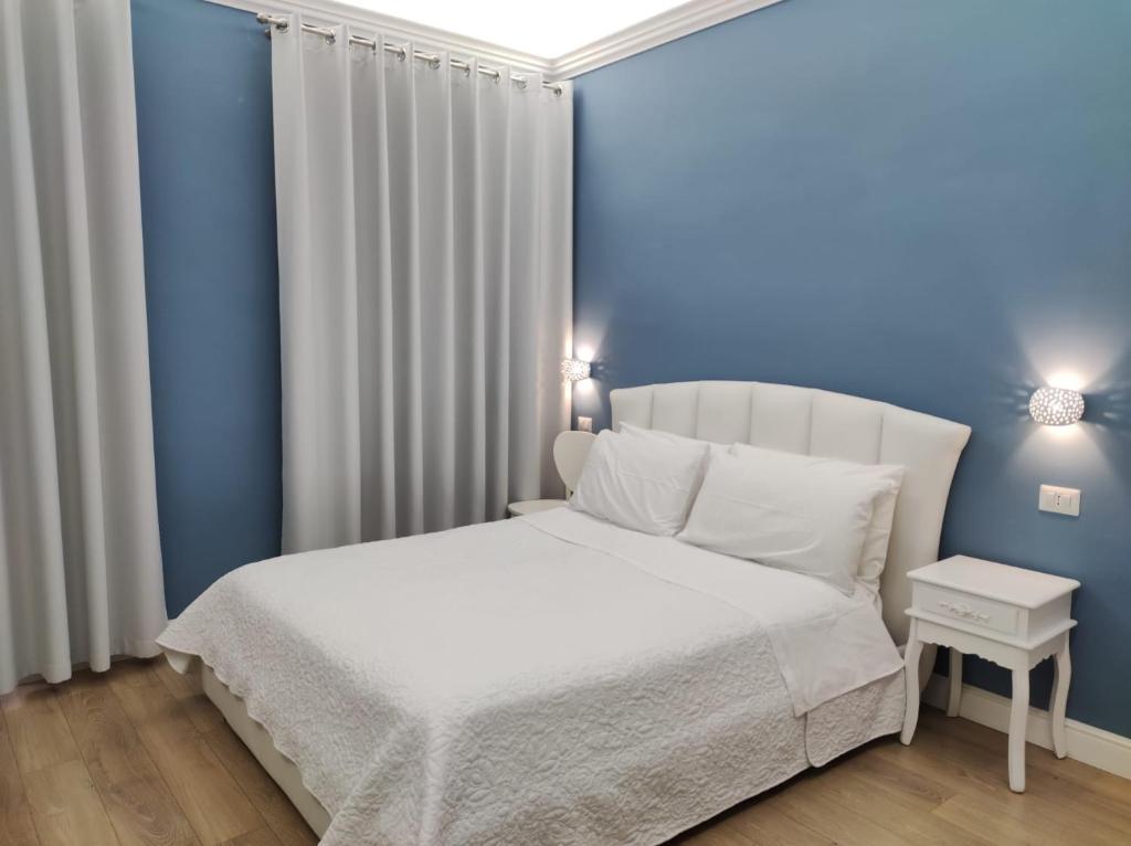 Postel nebo postele na pokoji v ubytování Porta d'Alpi