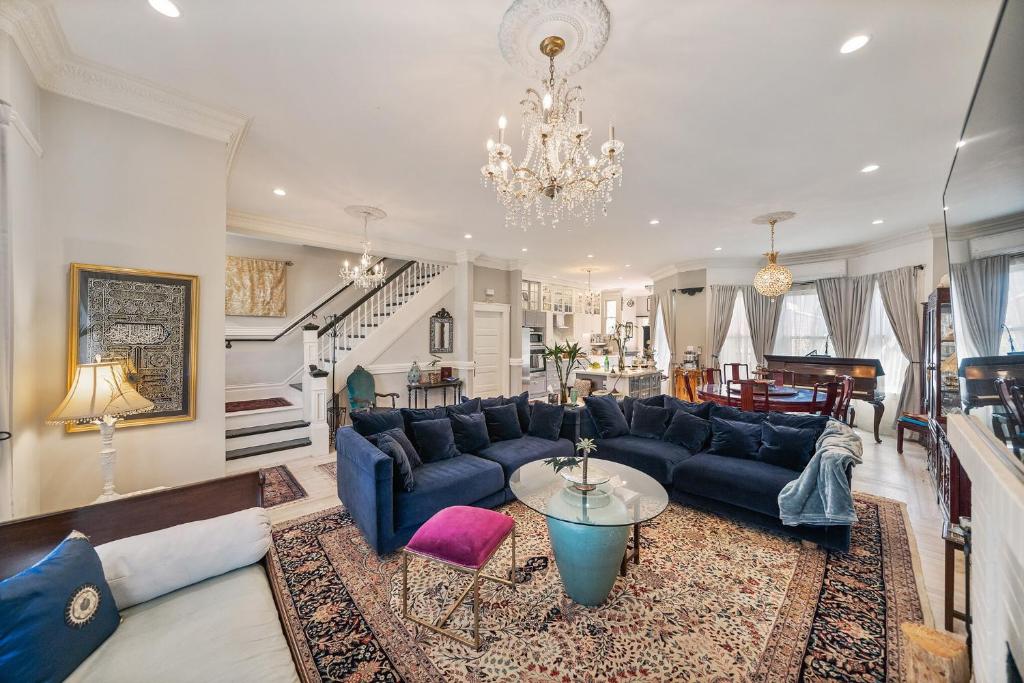 a living room with a blue couch and a table at San Francisco Retreat Just Steps from Golden Gate Park and Ocean Beach! home in San Francisco