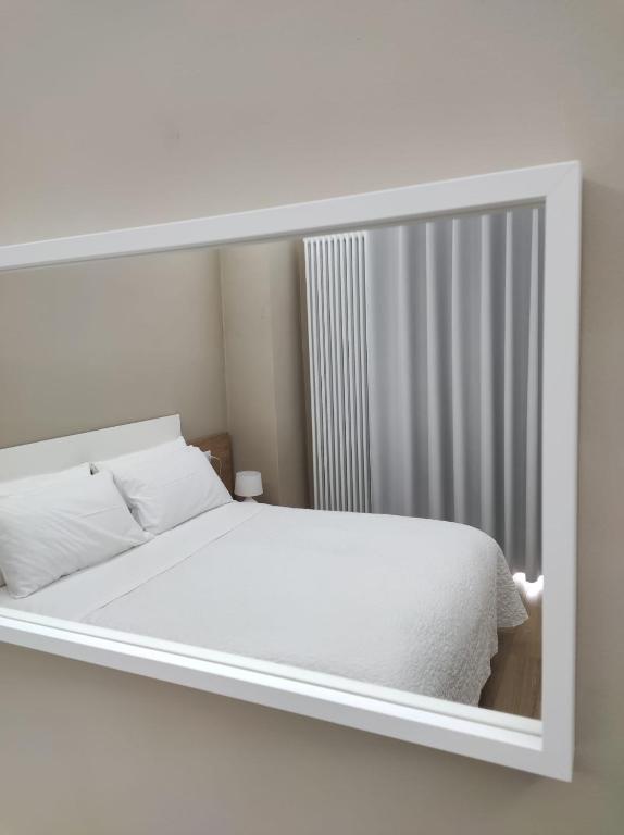 Postel nebo postele na pokoji v ubytování Porta d'Alpi