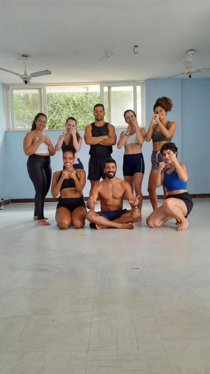 a group of people sitting in a dance class at Nomads Hostel Multicultural & Coworking in Salvador