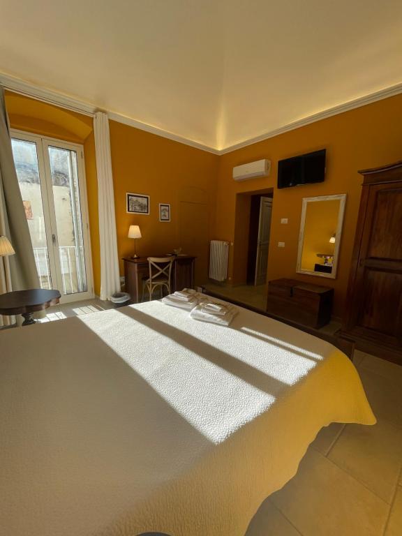 TV a/nebo společenská místnost v ubytování Il Borgo