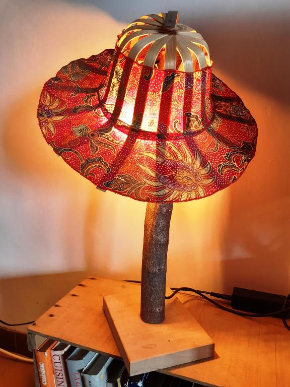 a lamp on top of a wooden table at La Pause in Plombières