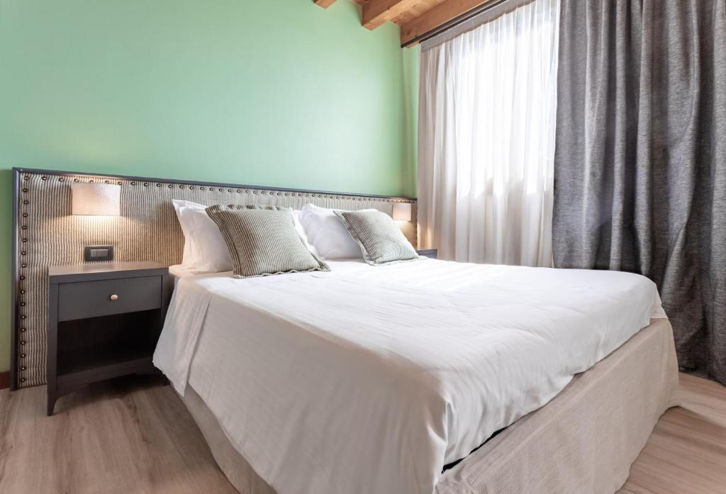 Postel nebo postele na pokoji v ubytování Boutique Hotel Municipio 1815
