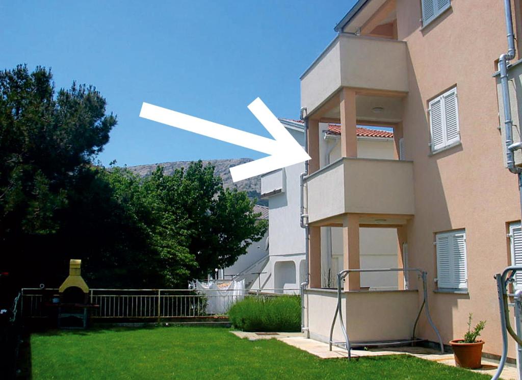 a large white object on the side of a building at Apartment Jozic in Baška
