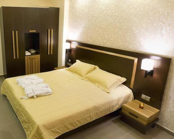 Postel nebo postele na pokoji v ubytování Dion Hotel