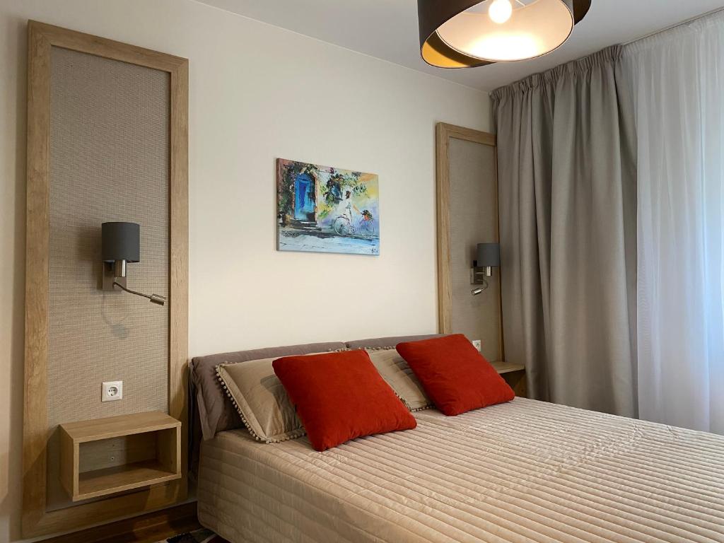 Arletti Luxury Apartment tesisinde bir odada yatak veya yataklar
