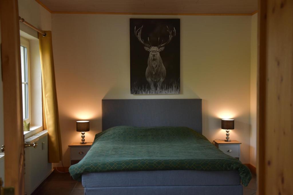 Postel nebo postele na pokoji v ubytování Gîte du cheval blanc d'Houmont