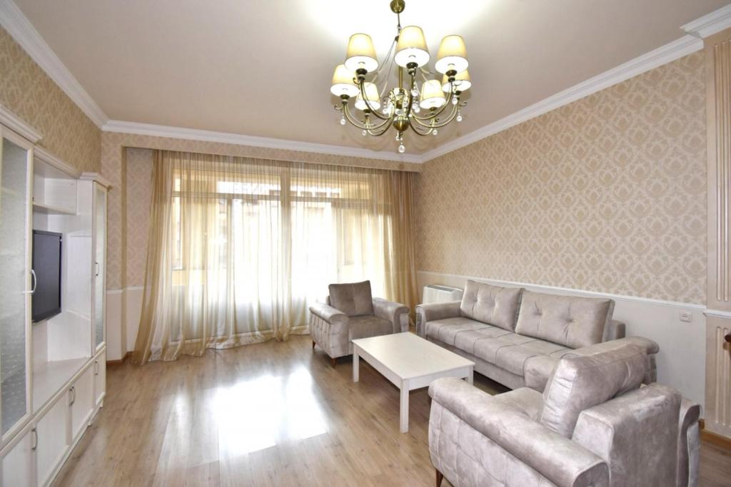 a living room with a couch and a tv at Northern Avenue, 2 bedrooms Unique, Luxury apartment with Special Open balcony HH567 in Yerevan