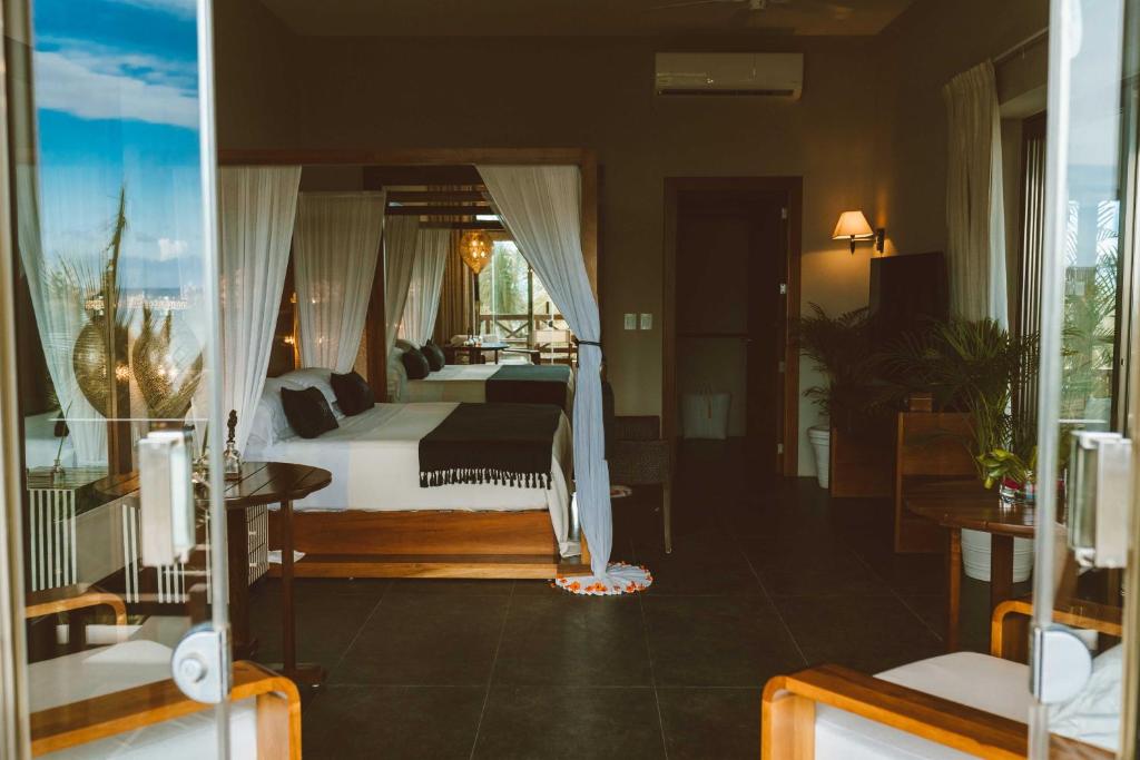 Postel nebo postele na pokoji v ubytování Jashita Hotel