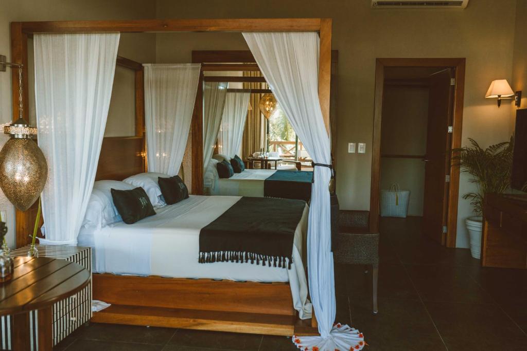 Postel nebo postele na pokoji v ubytování Jashita Hotel