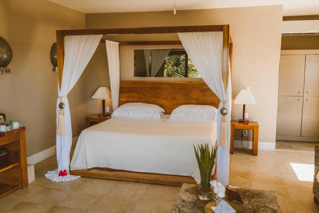 Postel nebo postele na pokoji v ubytování Jashita Hotel