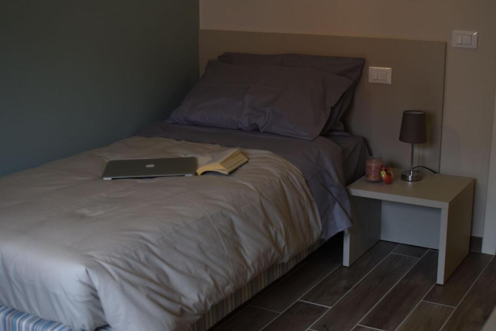 A bed or beds in a room at Hotel Cavallo Bianco