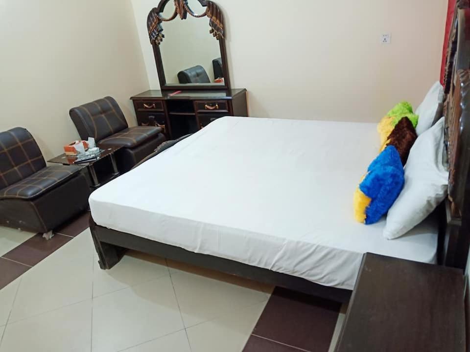 En eller flere senge i et værelse på Hotel 4 Seasons