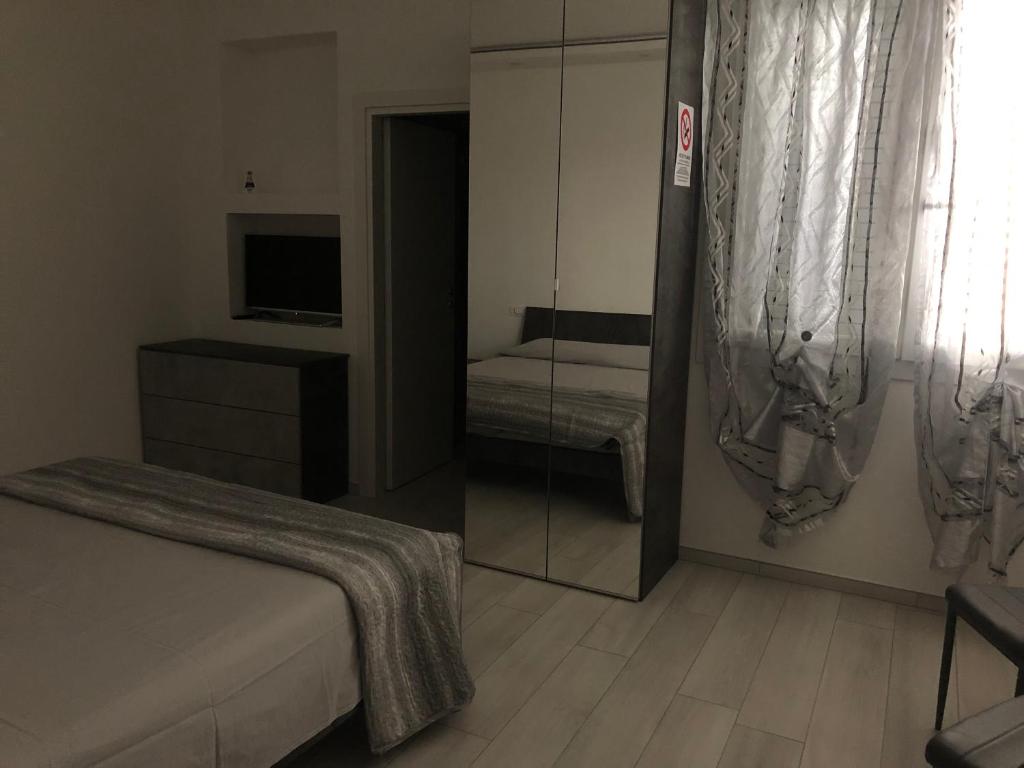 Postel nebo postele na pokoji v ubytování RoomsCarli
