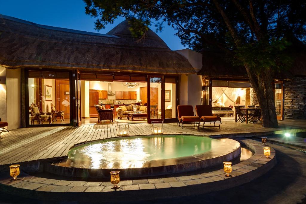 a pool in the middle of a patio at Tintswalo Safari in Manyeleti Game Reserve