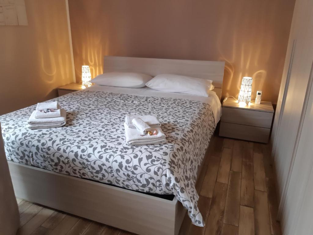 Кровать или кровати в номере Appartamento Sophia