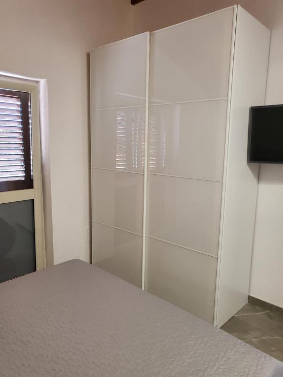 TV a/nebo společenská místnost v ubytování Residenza Carlucci