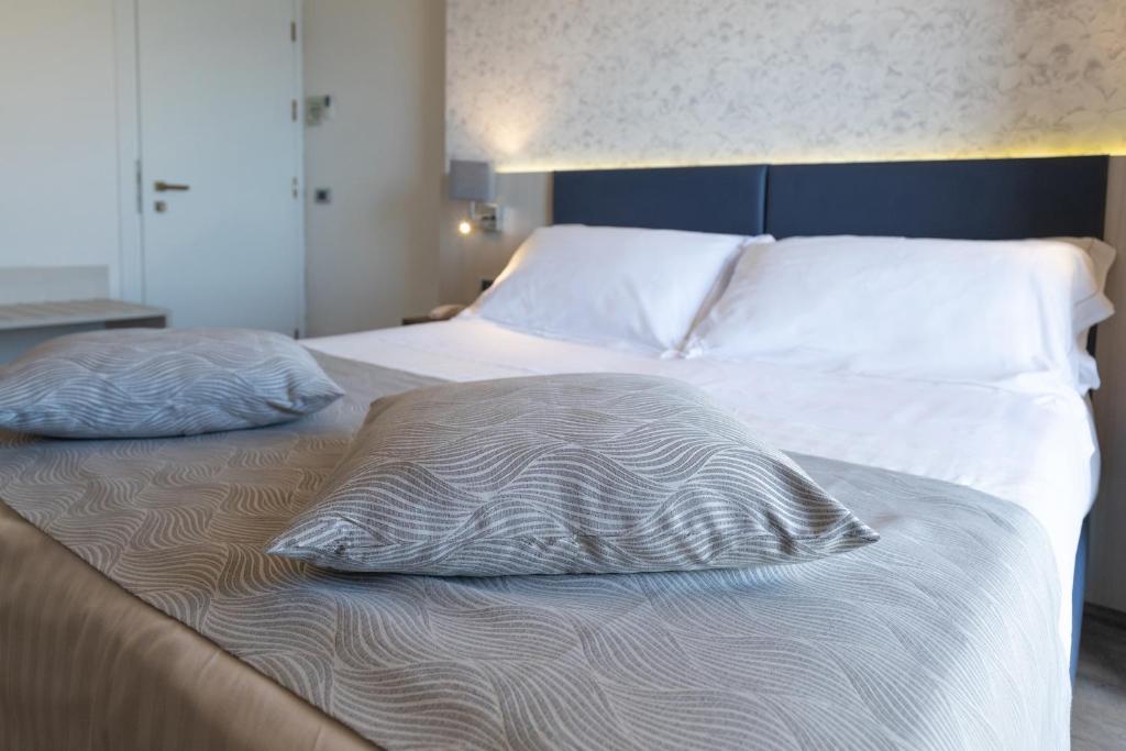 Łóżko lub łóżka w pokoju w obiekcie Splendid Hotel Taormina