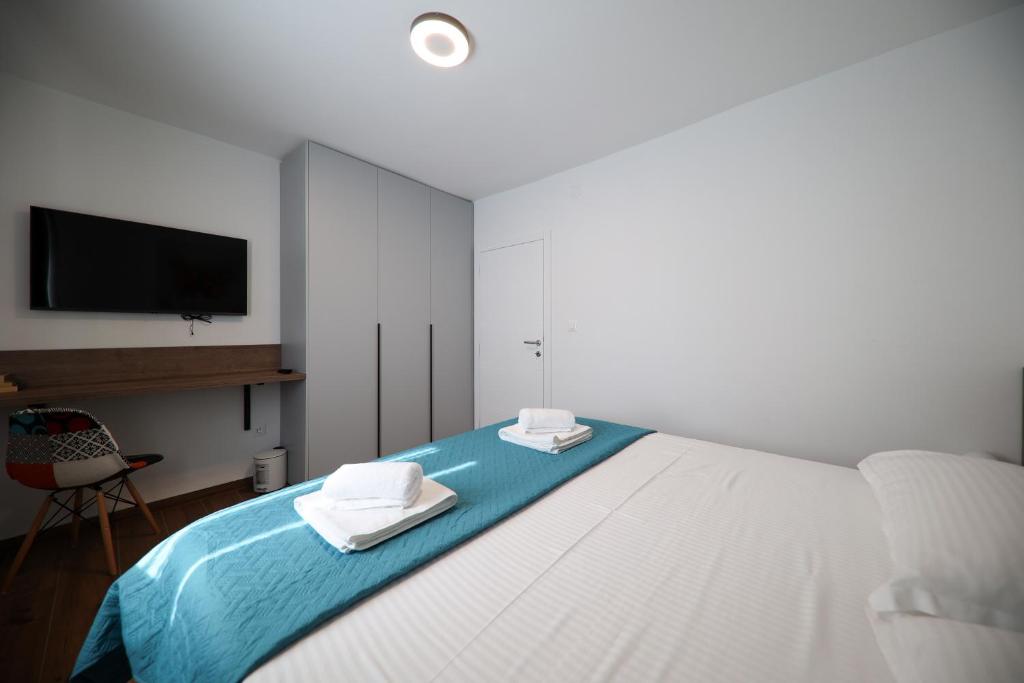 Posteľ alebo postele v izbe v ubytovaní Apartmani Diklo
