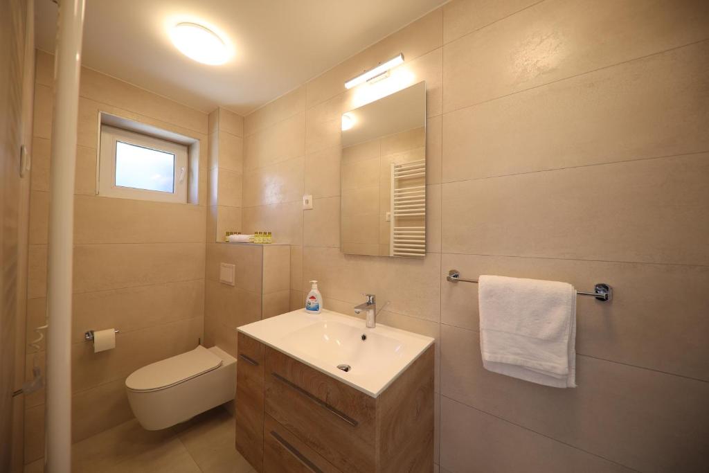 Kúpeľňa v ubytovaní Apartmani Diklo